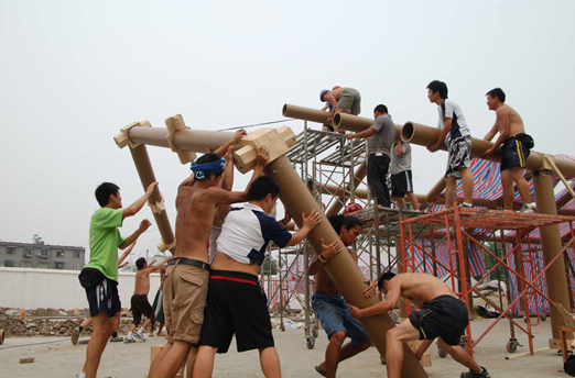 volunteers coming together to build temporary classrooms in chengdu